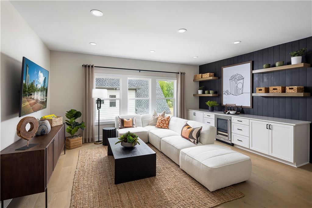 760 Keystone Drive Woodstock, GA 30188 - Photo 8 of 26 a living room with furniture and a flat screen tv