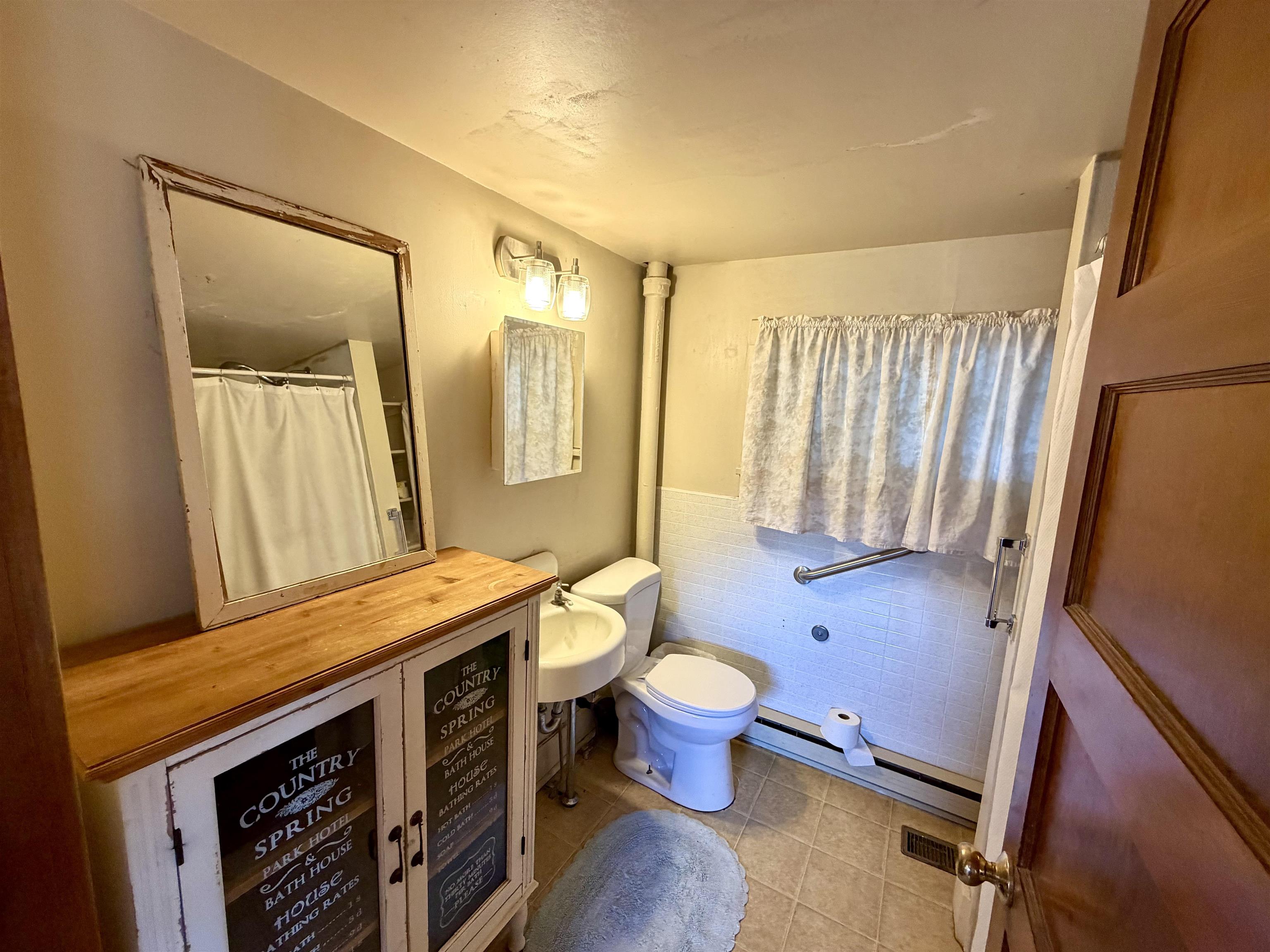 11260 54 7/10 Road Molina, CO 81646 - Photo 10 of 31 a bathroom with a sink toilet a mirror and shower