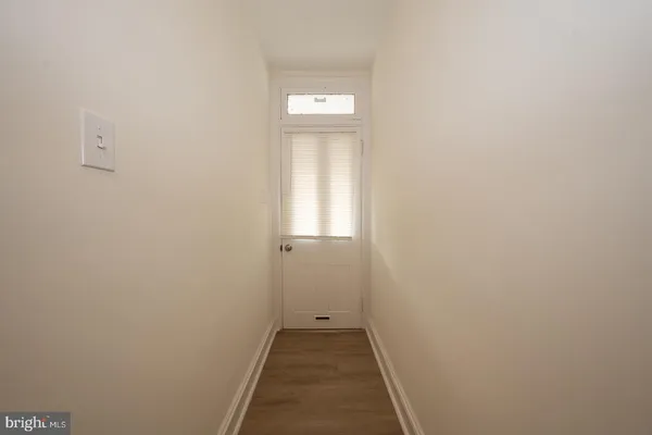 a living room with furniture and a chair