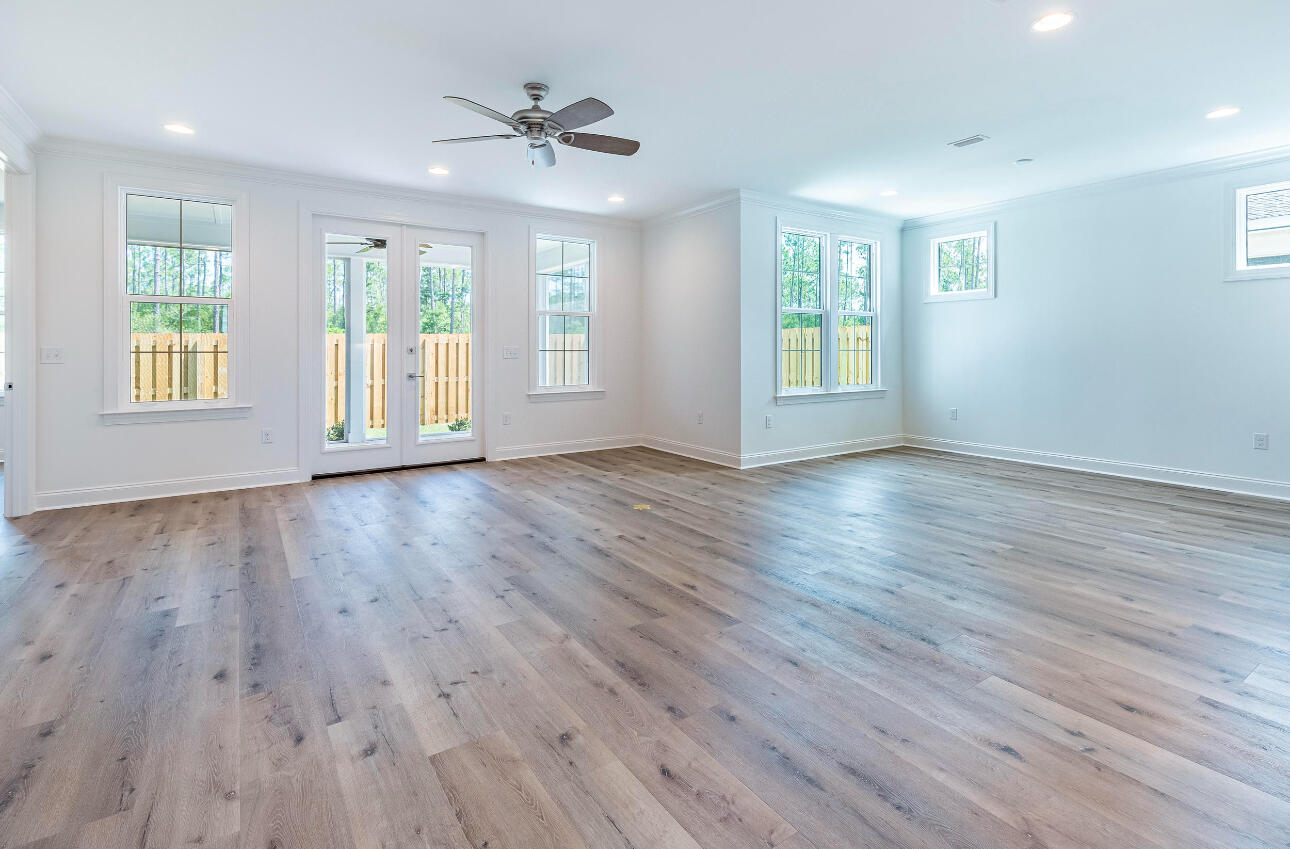 19 Conifer Ct Inlet Beach Inlet Beach, FL 32461 - Photo 4 of 5 a view of an empty room with wooden floor and a window