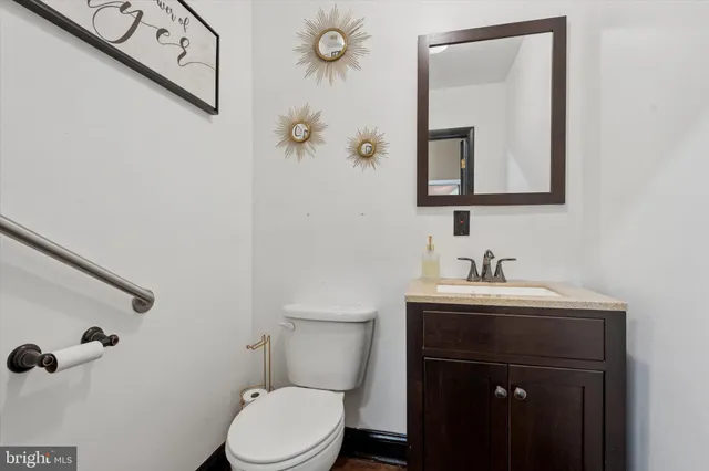 a kitchen with a refrigerator and a sink