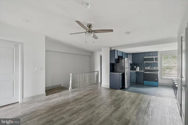 a kitchen with a refrigerator and a refrigerator