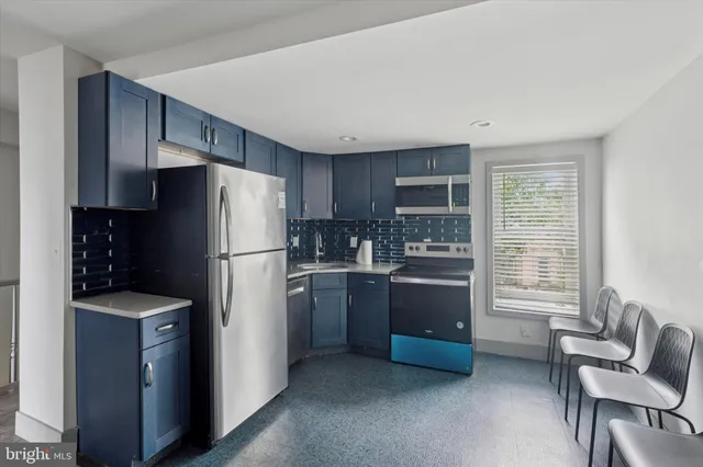 a view of room with hardwood floor and white cabinet
