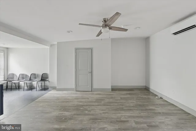a bathroom with a granite countertop sink and mirror