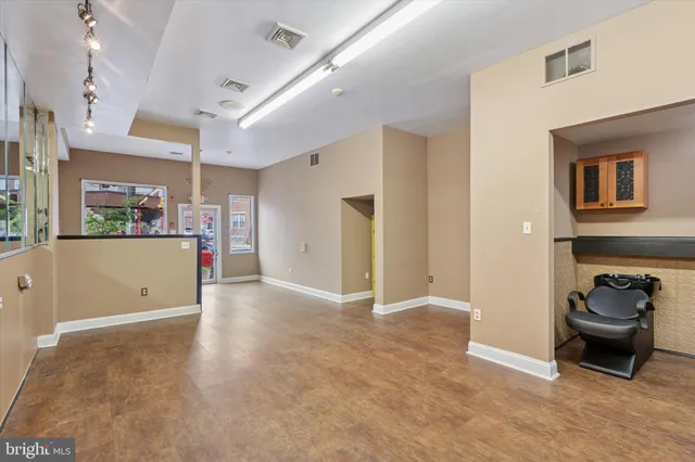 a view of a livingroom and a kitchen with furniture and a kitchen