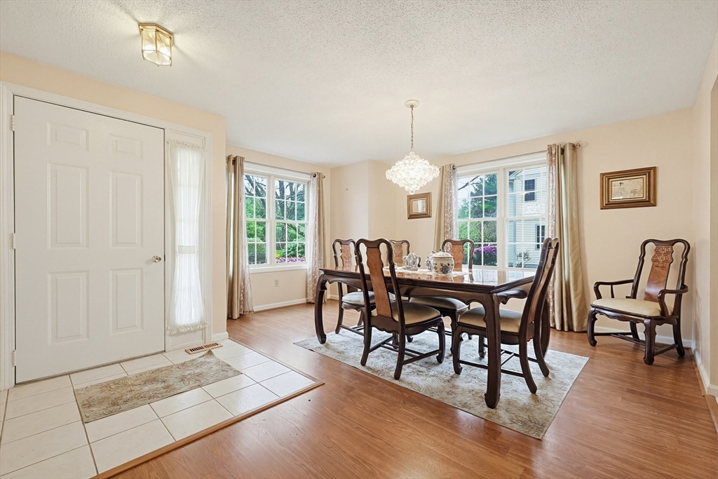 3301 Maple Brook Road, Unit 301 Bellingham, MA 02019 - Photo 10 of 29 a view of a dining room with furniture window and wooden floor