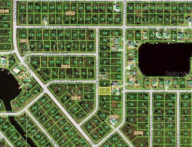 a view of a room with wooden floor and windows