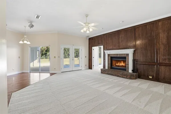 a view of an empty room with a fireplace