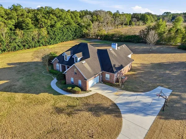 a view of a swimming pool with a yard