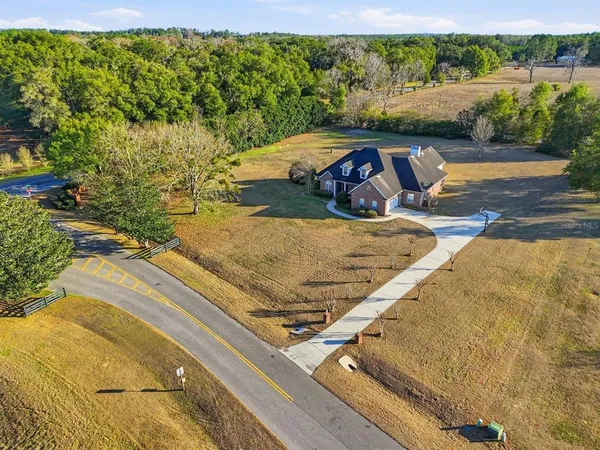 a view of a swimming pool with a yard