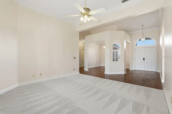 a view of empty room with a ceiling fan