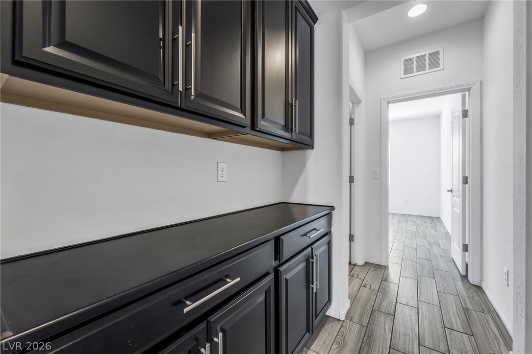 6245 Andover Wood Road Las Vegas, NV 89113 - Photo 25 of 37 Ample storage and counter space in this well-appointed hallway.