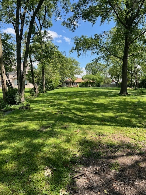 7740 South County Line Road Burr Ridge, IL 60527 - Photo 3 of 13 a view of a grassy field with trees