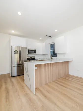 a view of kitchen with counter top space