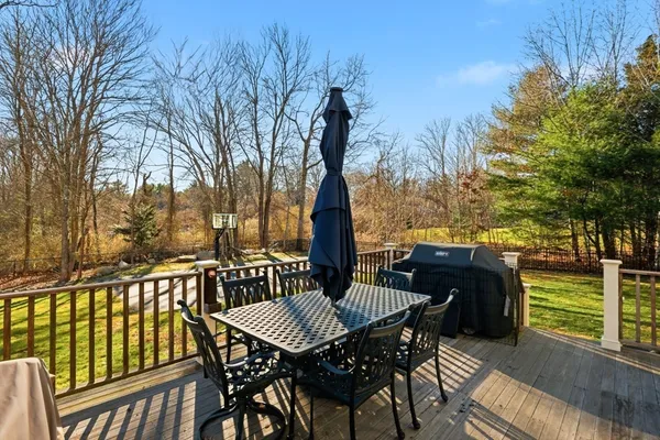 a view of a patio with iron fence