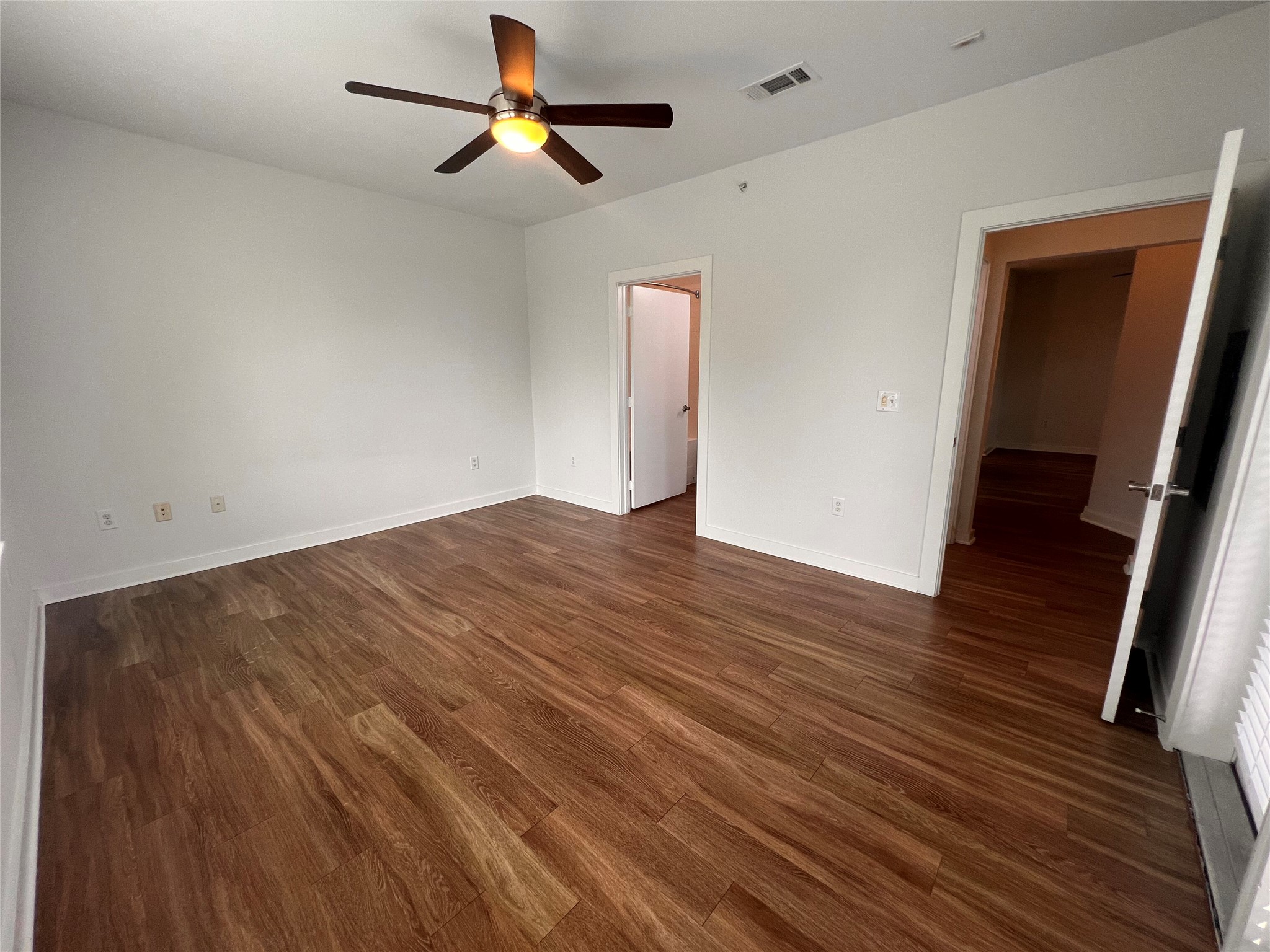 1900 Barton Springs Road, Unit 4041 Austin, TX 78704 - Photo 9 of 35 a view of empty room with wooden floor