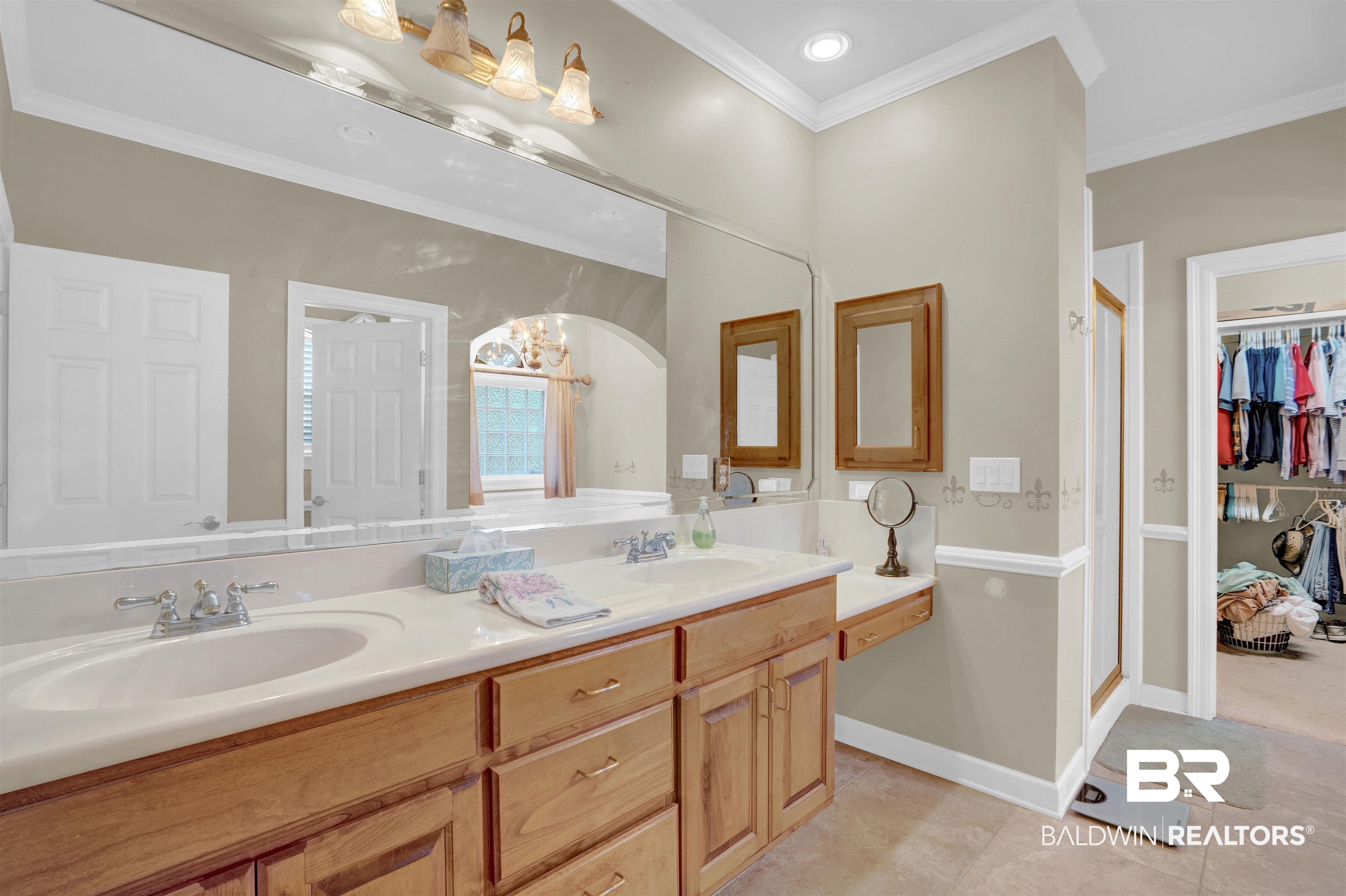10951 Driver Court Fairhope, AL 36532 - Photo 27 of 46 Bathroom with vanity, crown molding, and tile patterned flooring