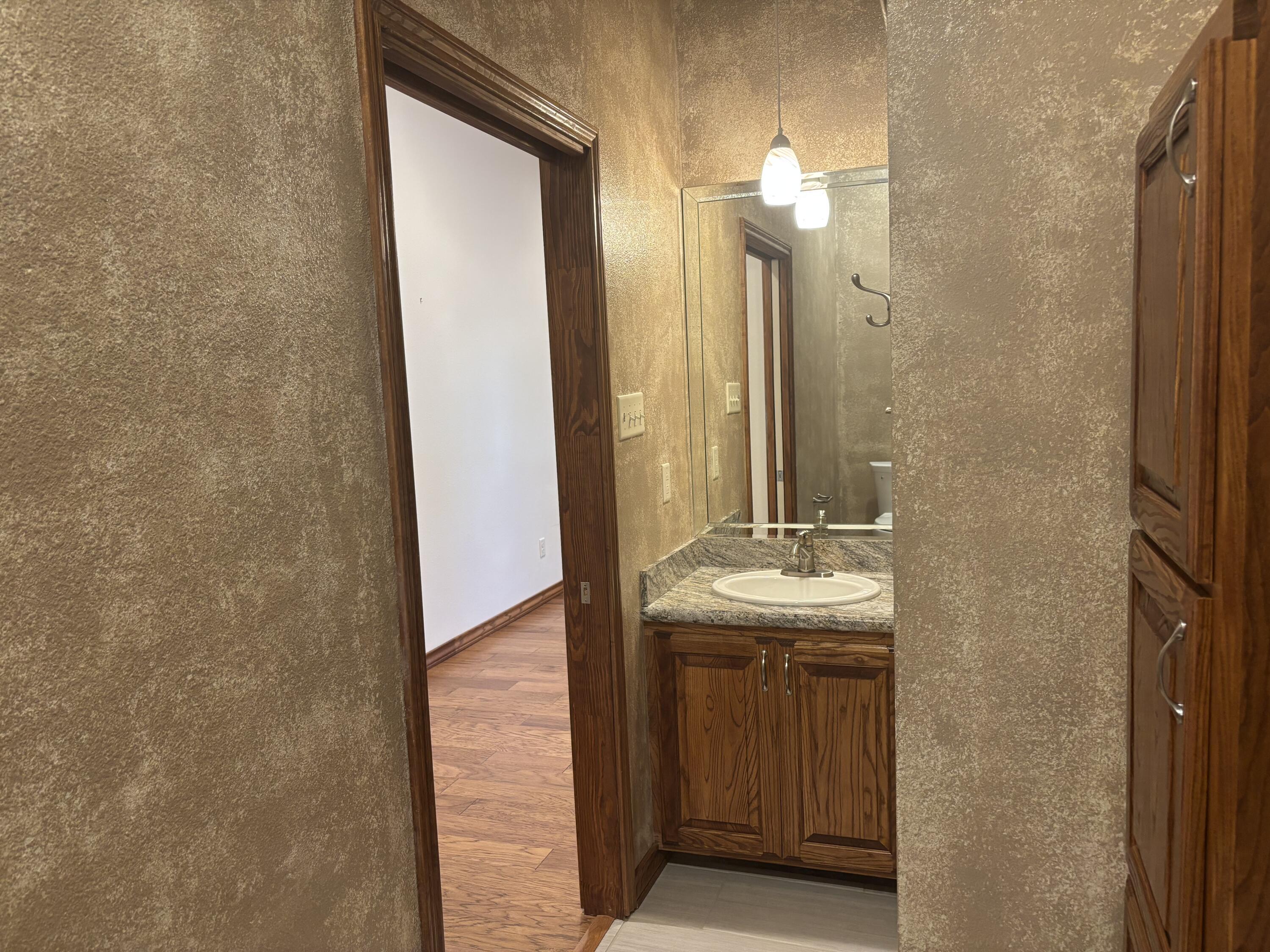 33 West Lakeshore Drive Ransom Canyon, TX 79366 - Photo 42 of 48 a bathroom with a sink and a mirror