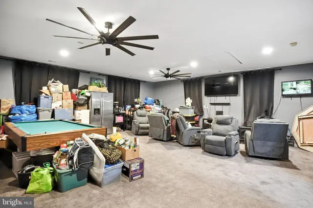 a bed room with furniture and a mirror