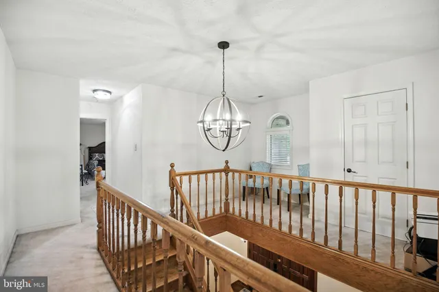 a bathroom with a tub sink and window