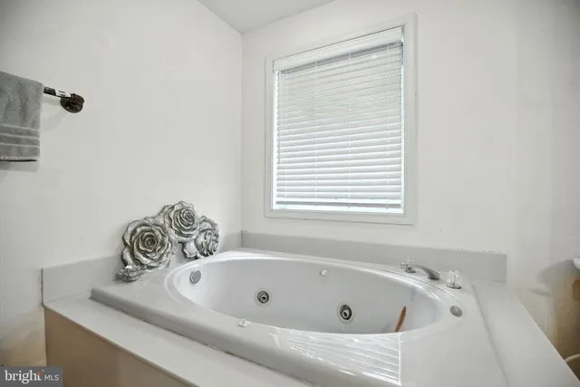 a bed room with furniture and a flat screen tv