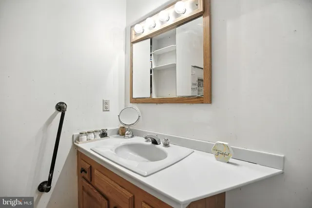 a view of a wooden deck and backyard