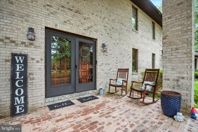 a view of a chair and table in backyard