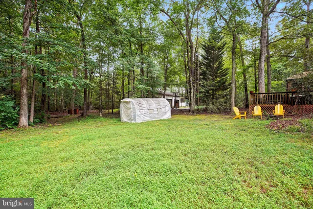 a view of outdoor space with deck and garden