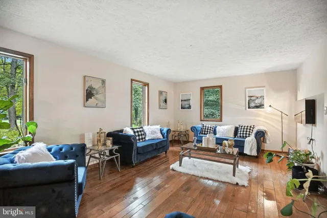 a kitchen with stainless steel appliances granite countertop a refrigerator and cabinets