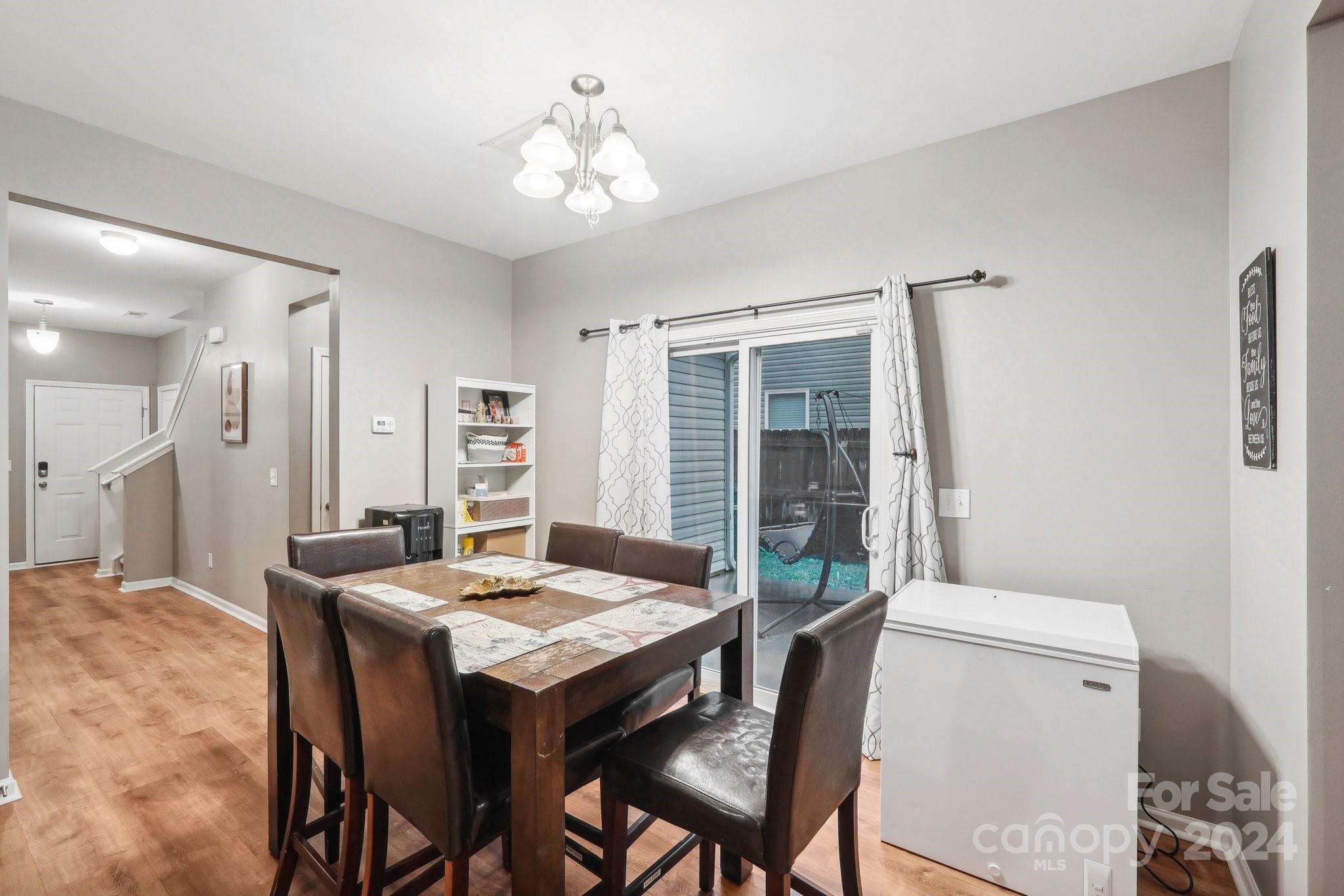 1065 Ramsgate Drive Southwest Concord, NC 28025 - Photo 13 of 47 a view of a dining room with furniture and a chandelier