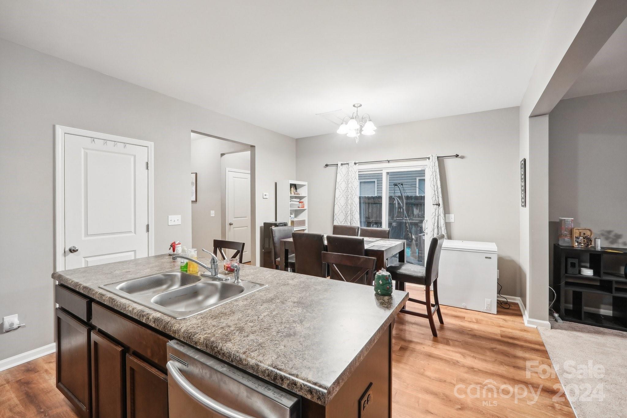 1065 Ramsgate Drive Southwest Concord, NC 28025 - Photo 17 of 47 a living room with granite countertop furniture and a dining table