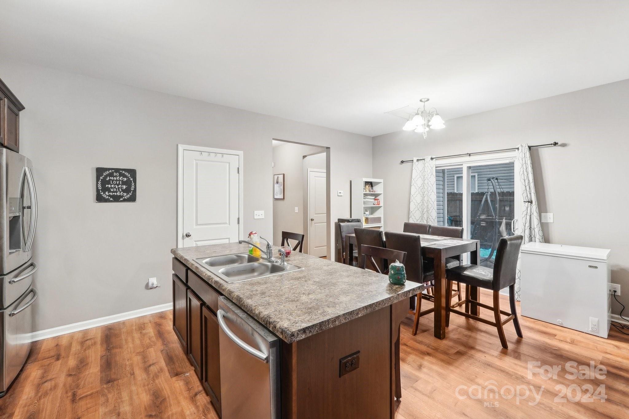 1065 Ramsgate Drive Southwest Concord, NC 28025 - Photo 18 of 47 a kitchen that has a table and chairs in it