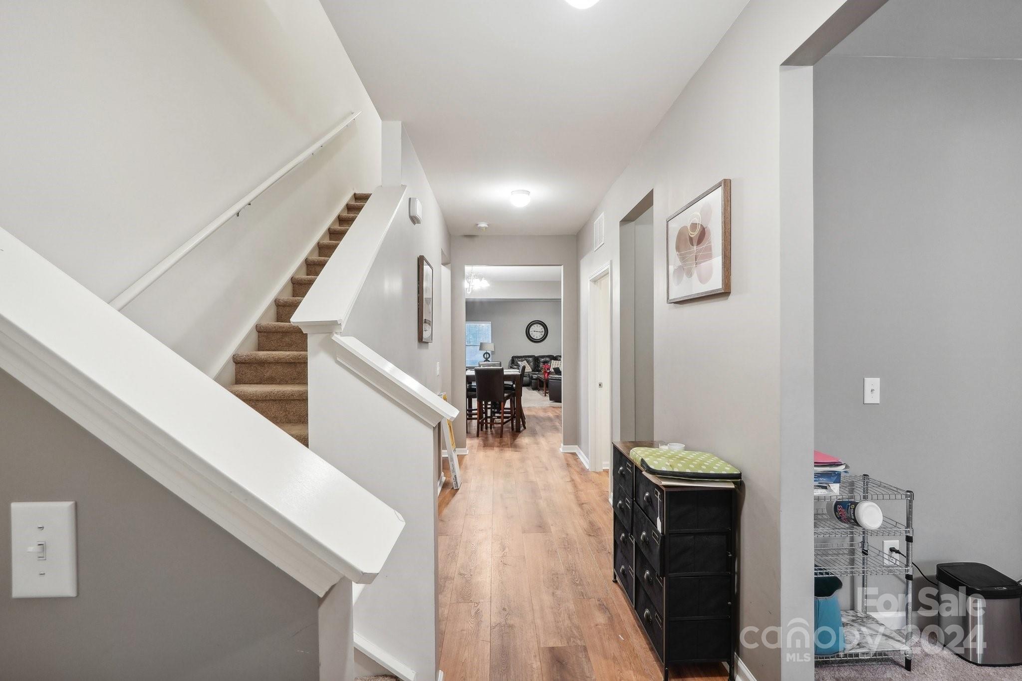 1065 Ramsgate Drive Southwest Concord, NC 28025 - Photo 19 of 47 a view of a living room and entryway with wooden floor
