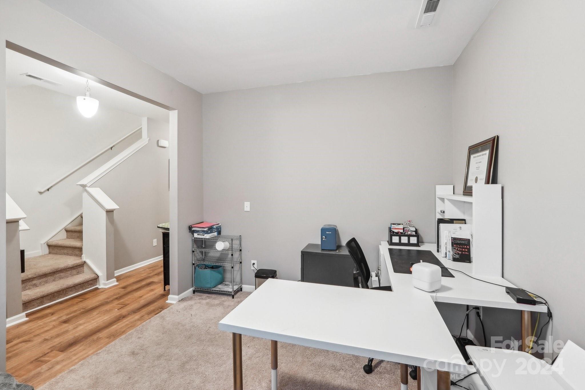 1065 Ramsgate Drive Southwest Concord, NC 28025 - Photo 21 of 47 a living room with furniture a rug and white walls