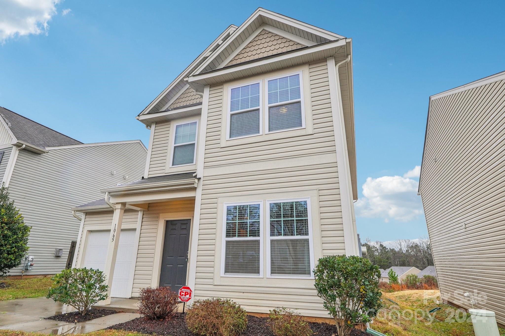 1065 Ramsgate Drive Southwest Concord, NC 28025 - Photo 3 of 47 a front view of a house with a yard