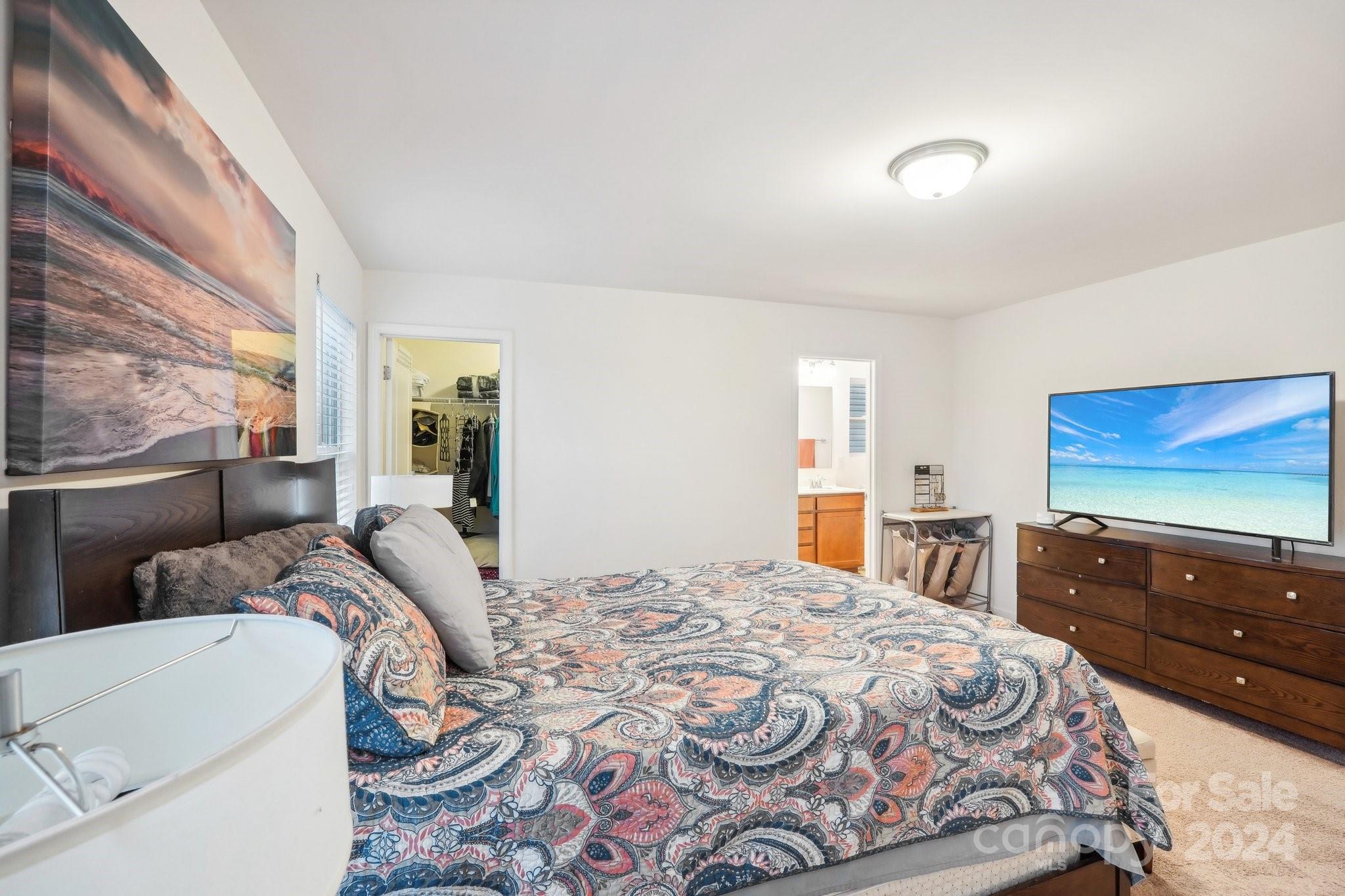 1065 Ramsgate Drive Southwest Concord, NC 28025 - Photo 31 of 47 a bedroom with a bed and a flat screen tv