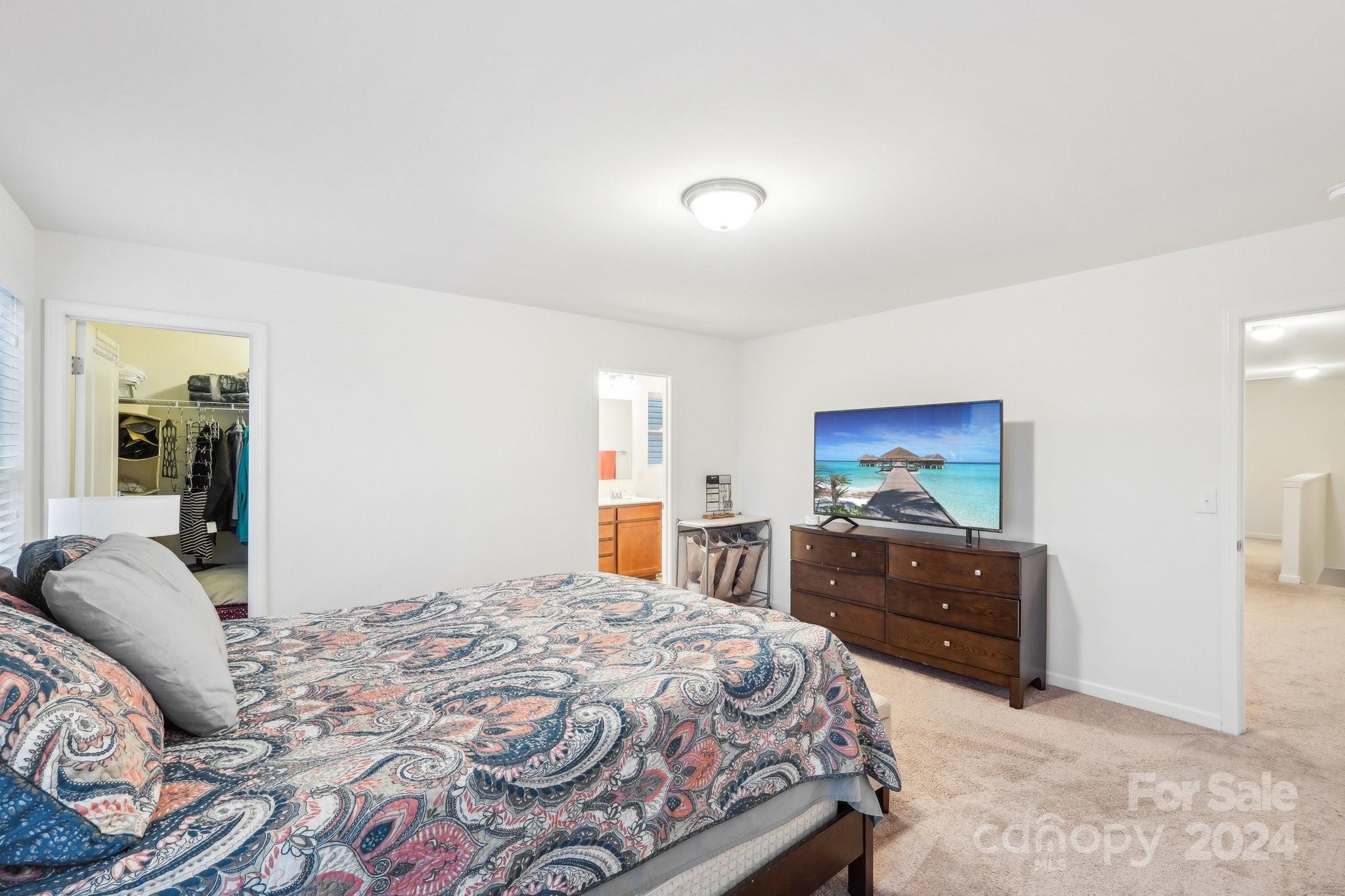 1065 Ramsgate Drive Southwest Concord, NC 28025 - Photo 32 of 47 a bedroom with a bed and a flat screen tv