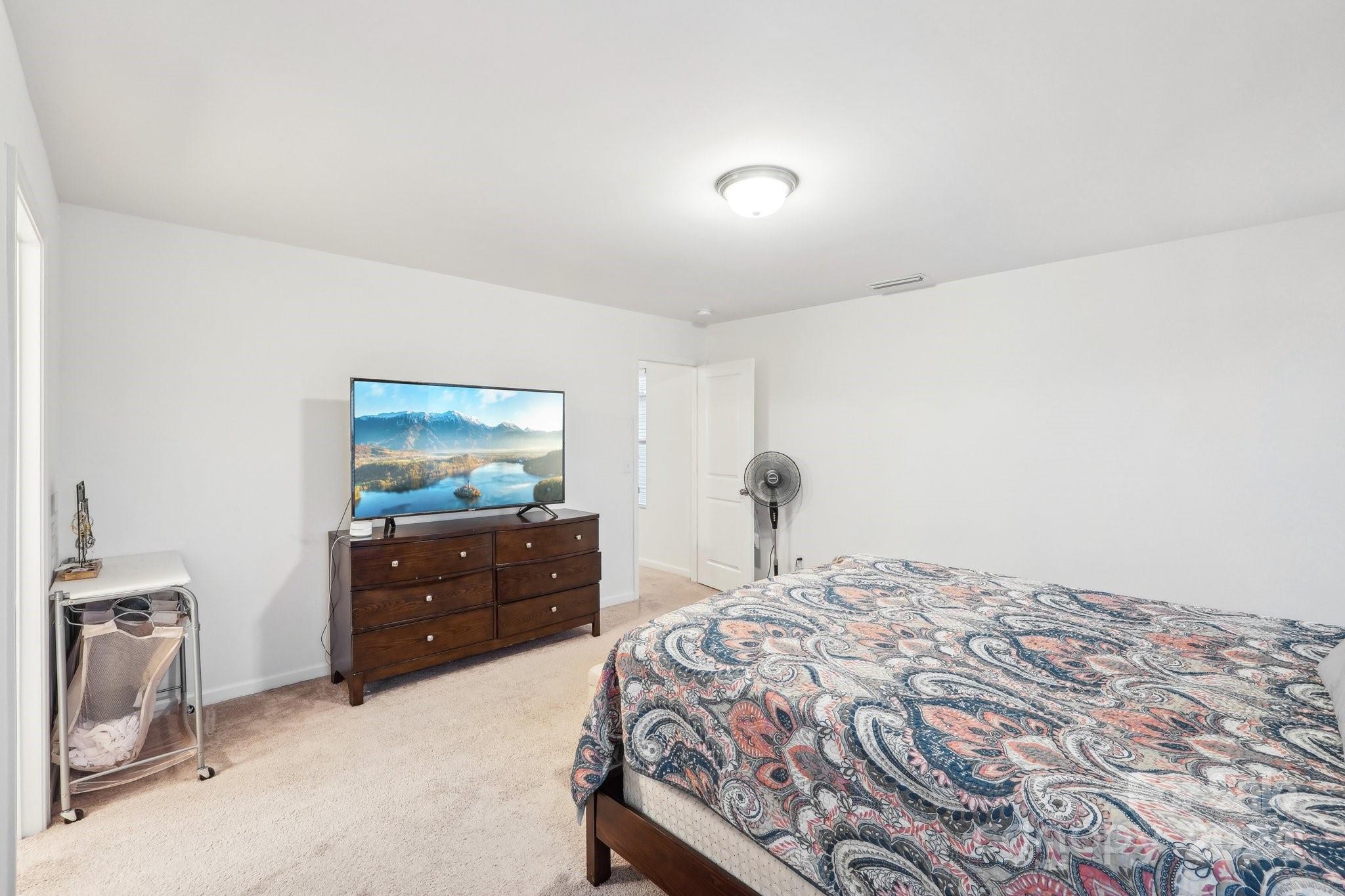 1065 Ramsgate Drive Southwest Concord, NC 28025 - Photo 33 of 47 a bedroom with a bed and a dresser
