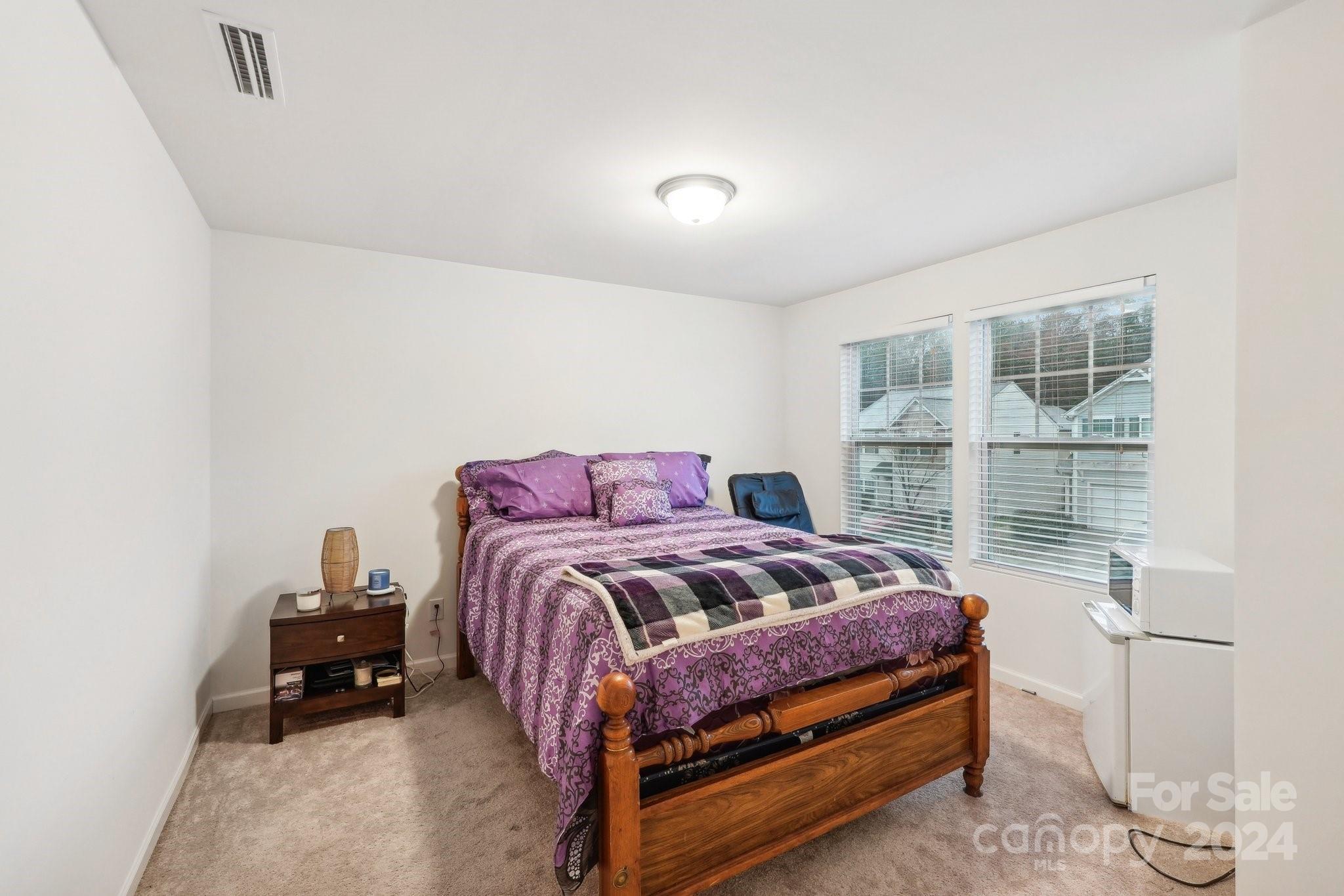 1065 Ramsgate Drive Southwest Concord, NC 28025 - Photo 35 of 47 a bedroom with a bed and a window