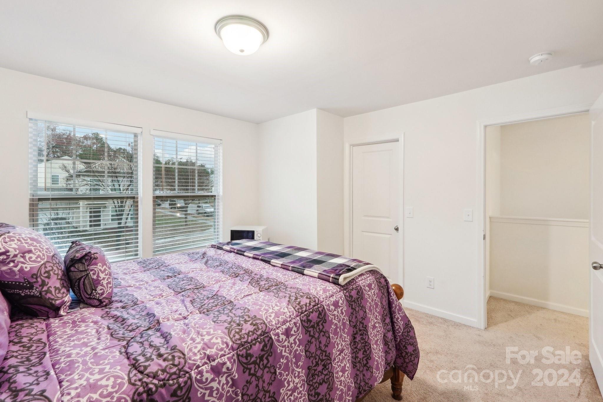 1065 Ramsgate Drive Southwest Concord, NC 28025 - Photo 37 of 47 a bedroom with a large bed and a window