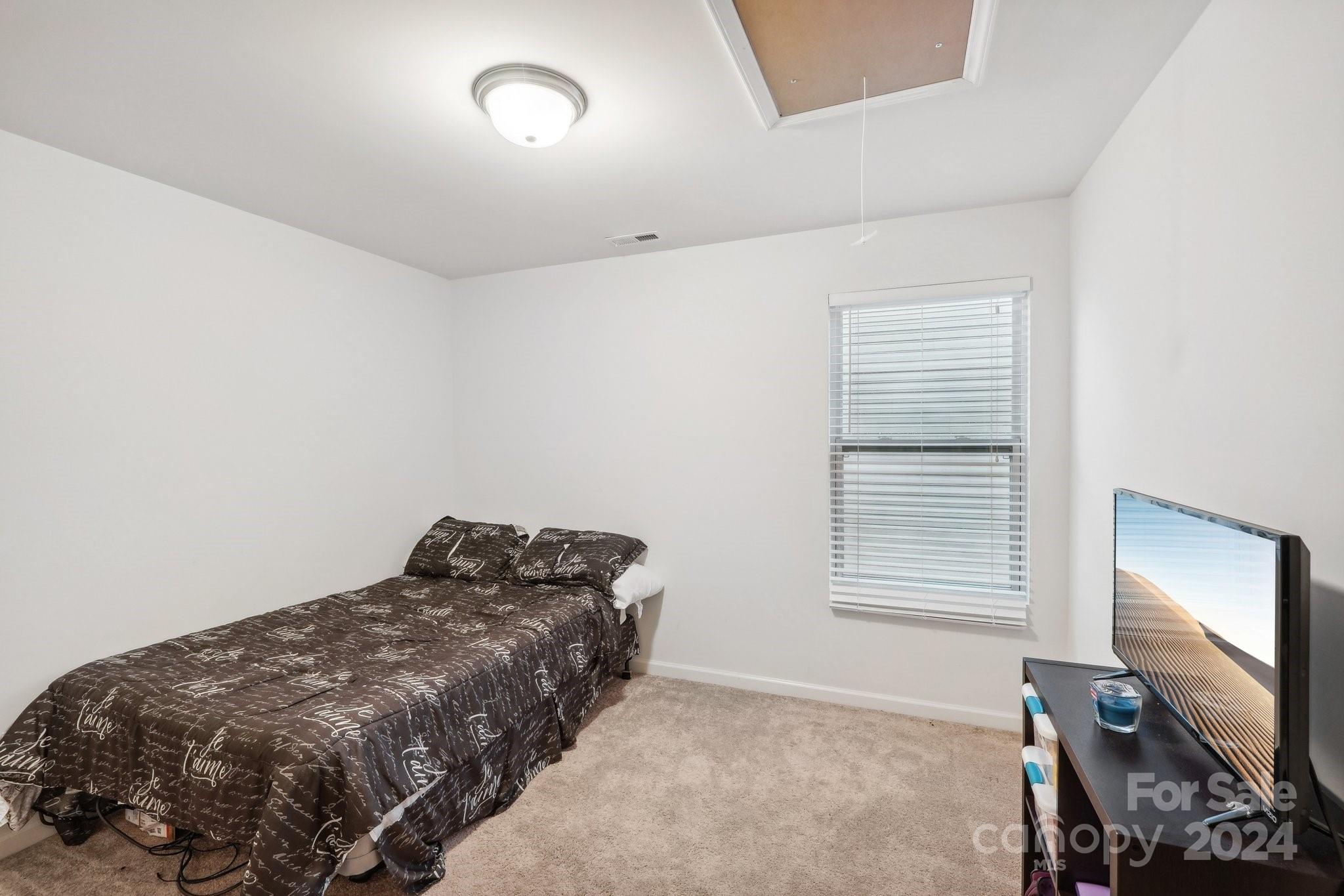 1065 Ramsgate Drive Southwest Concord, NC 28025 - Photo 39 of 47 a bedroom with a bed and a window