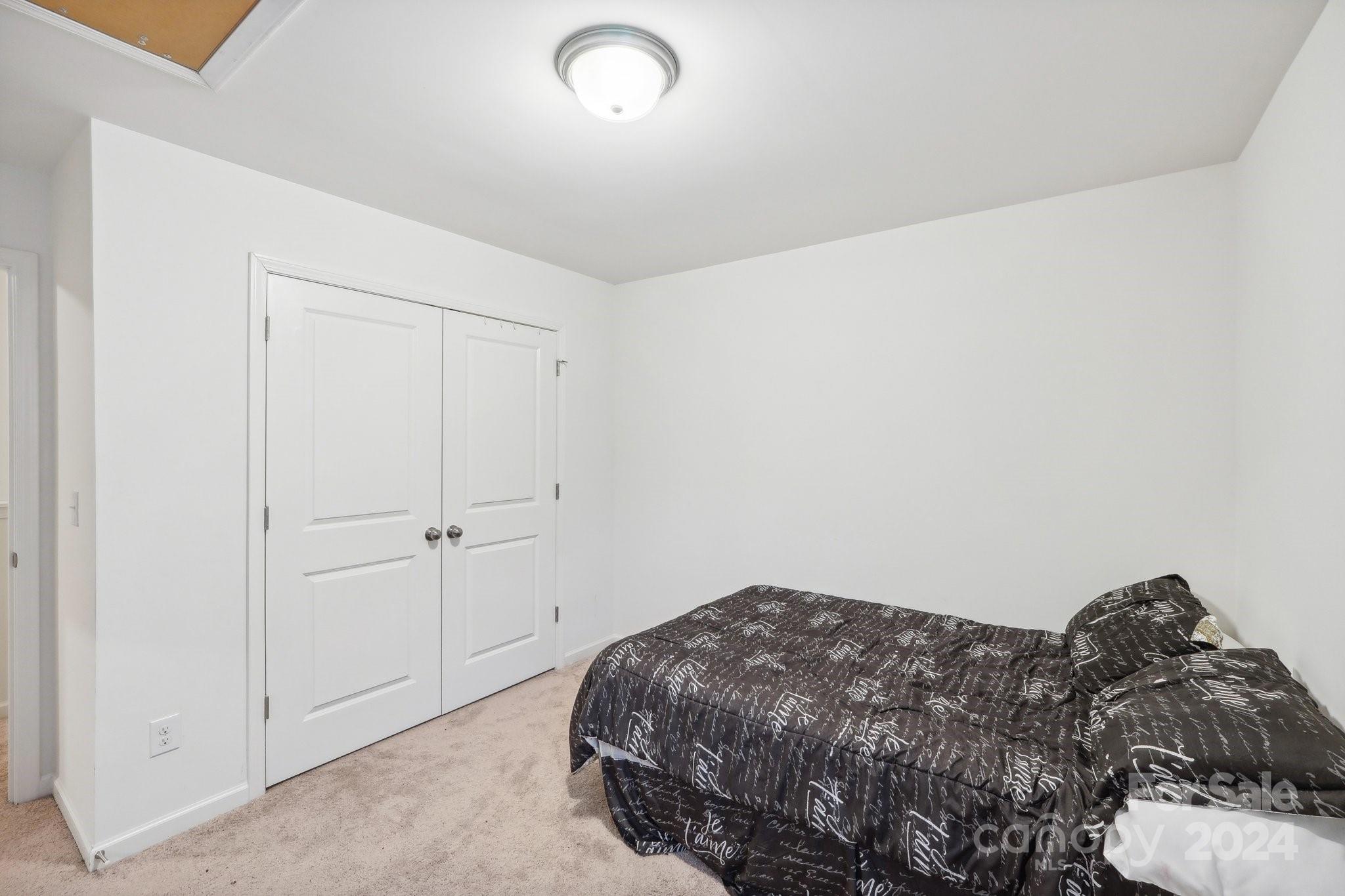 1065 Ramsgate Drive Southwest Concord, NC 28025 - Photo 40 of 47 a bedroom with a bed and pillows