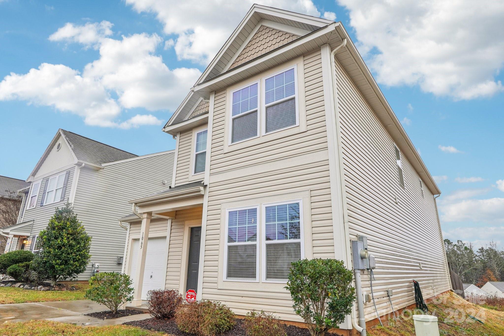 1065 Ramsgate Drive Southwest Concord, NC 28025 - Photo 4 of 47 a front view of a house with a yard