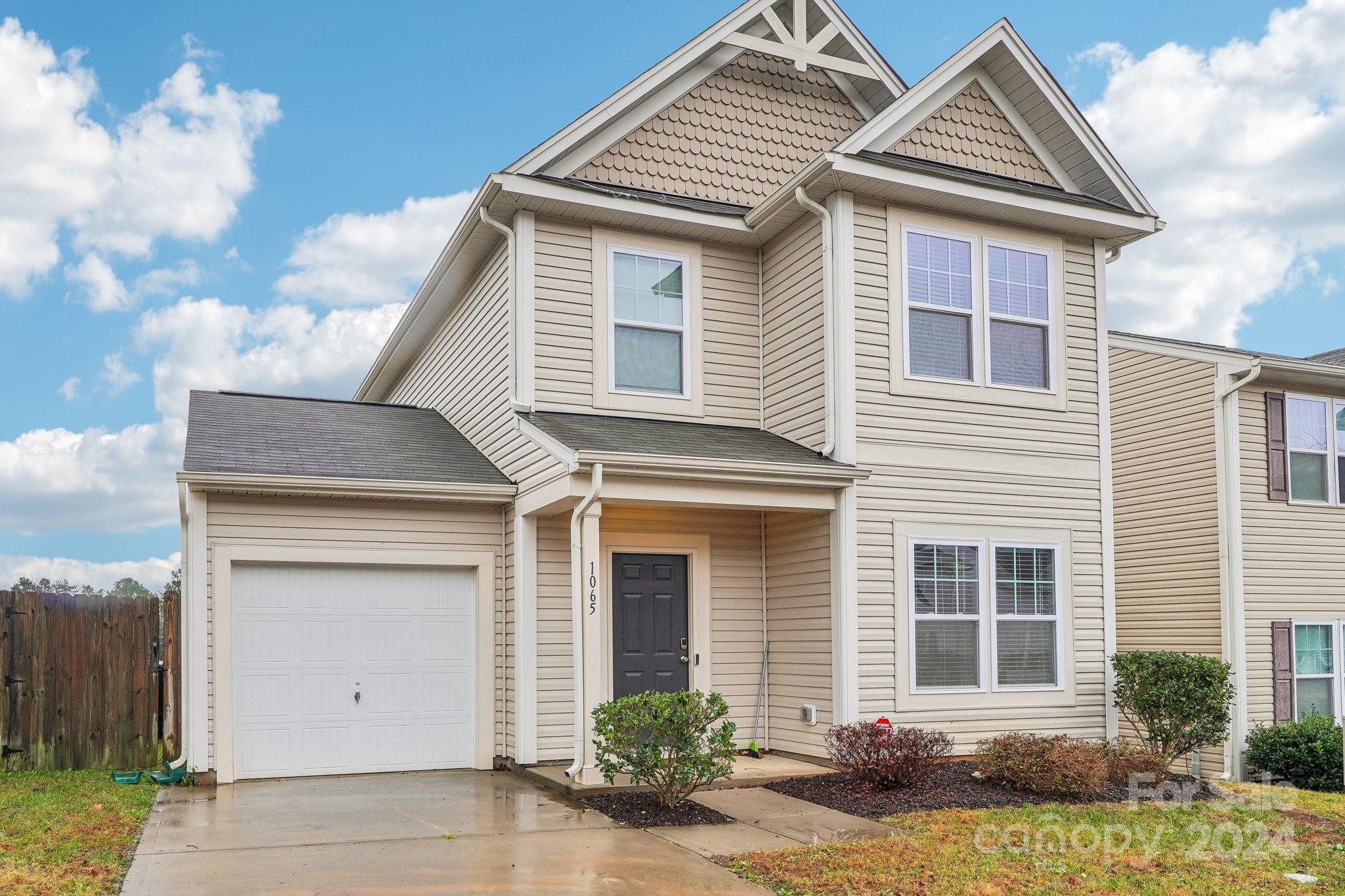 1065 Ramsgate Drive Southwest Concord, NC 28025 - Photo 5 of 47 a front view of a house with garden