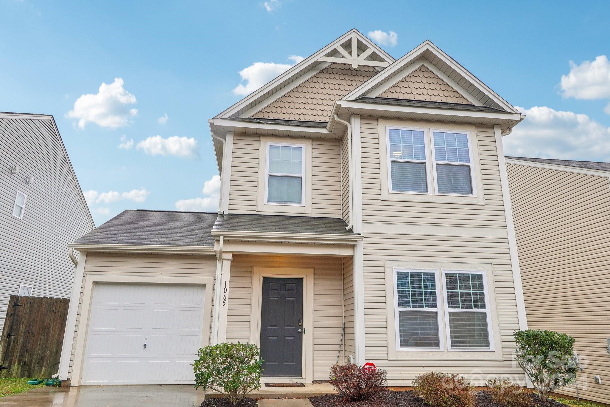 1065 Ramsgate Drive Southwest Concord, NC 28025 - Photo 6 of 47 a front view of a house with a yard