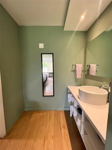 a bathroom with a sink and a mirror