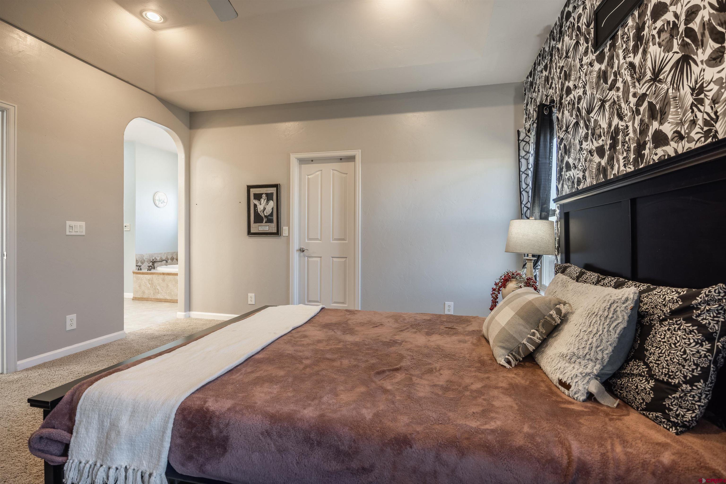 1443 Criterion Street Delta, CO 81416 - Photo 11 of 36 a bedroom with a bed and window