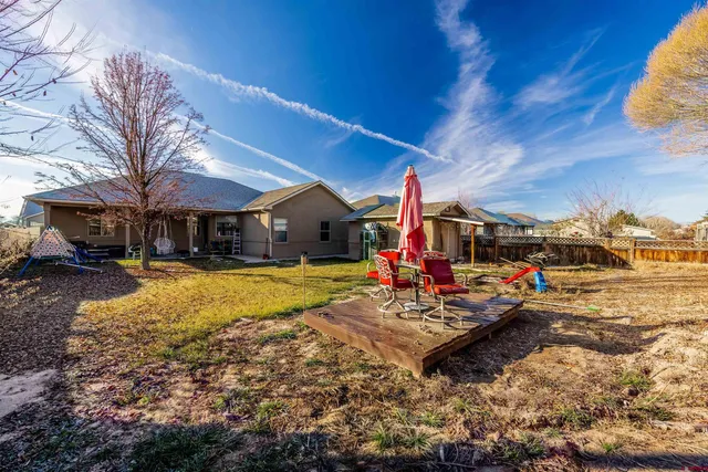 a view of yard with swimming pool and sitting area