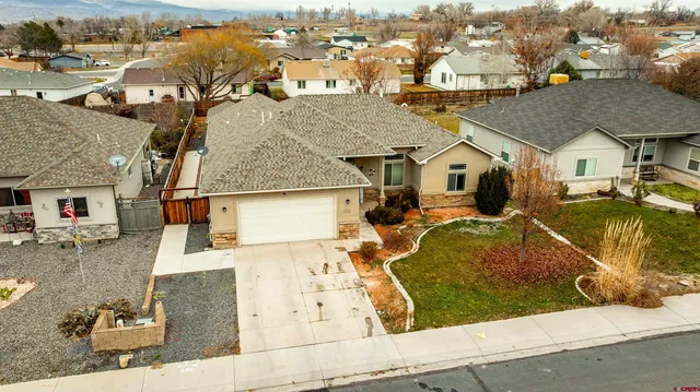 an aerial view of a house with swimming pool