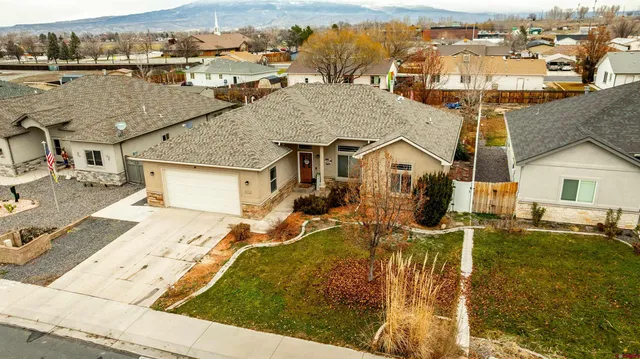 an aerial view of residential houses with outdoor space